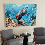 Sea turtle and coral wall art displayed above two gray chairs and a small round table