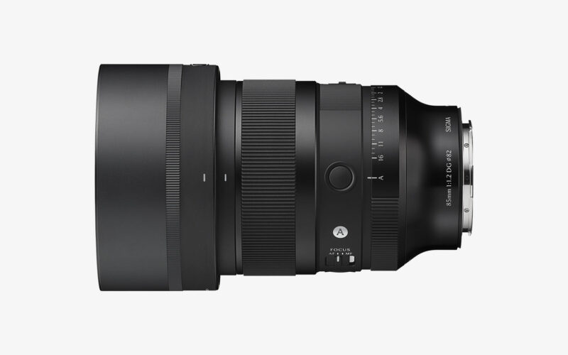 Side view of the Sigma 85mm F1.2 DG Art lens with lens hood attached
